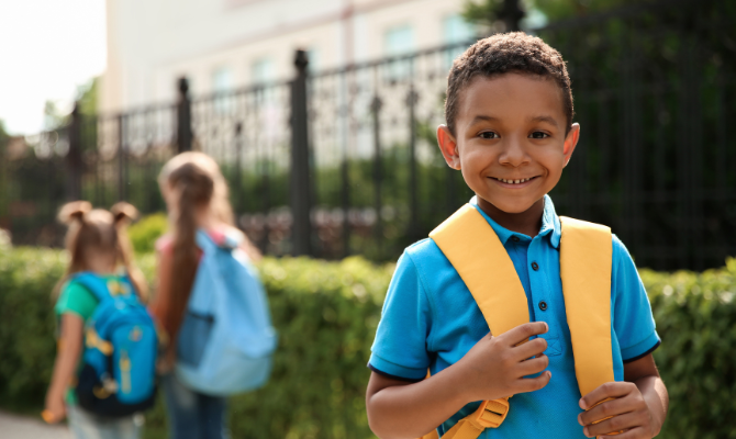 Philadelphia student smiling with a new backpack
